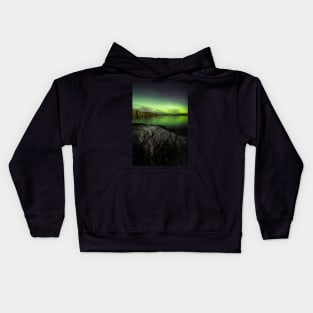 Northern lights glowing over lake in Finland Kids Hoodie